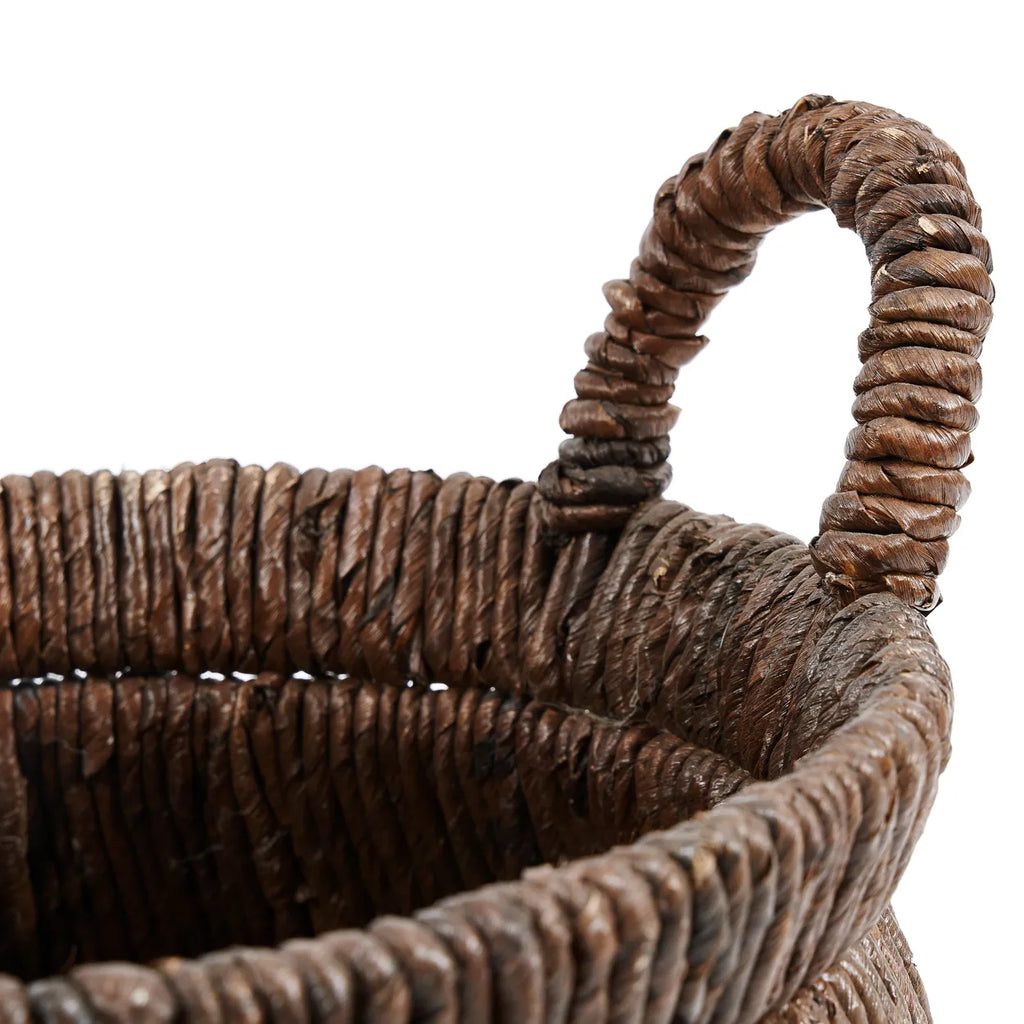 Chizara Mand Basket placed in a neutral bedroom, offering elegant storage for household essentials