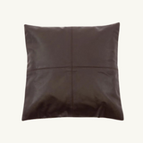 Chocolate Leather Cushion Cover with a four-panel design placed on a modern sofa, showcasing its luxurious chocolate calf leather and timeless elegance