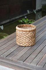 Eco-friendly Choppy Mand Laundry Basket on a covered outdoor terrace, blending functionality and natural design