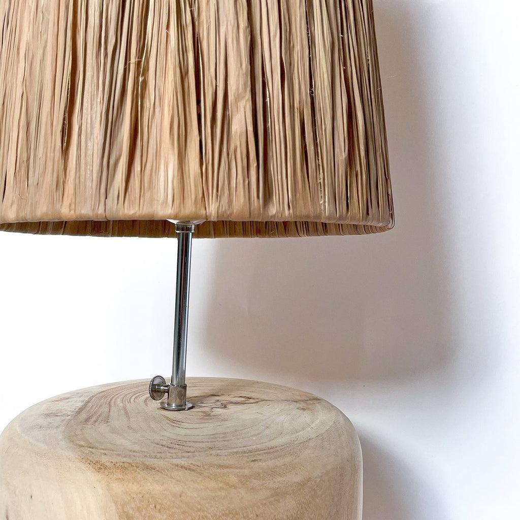 De Grass Teak Wood Table Lamp, inspired by luxurious Greek resorts, offers a warm and inviting ambiance with natural materials