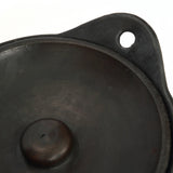 Durable and food-safe black burnt terracotta serving pot, conveniently dishwasher-safe for easy cleaning
