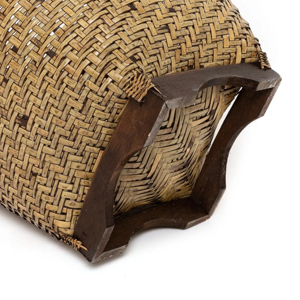 Elegant Colonial Handcrafted Rattan Laundry Basket showcasing its natural brown tones in a chic home setting