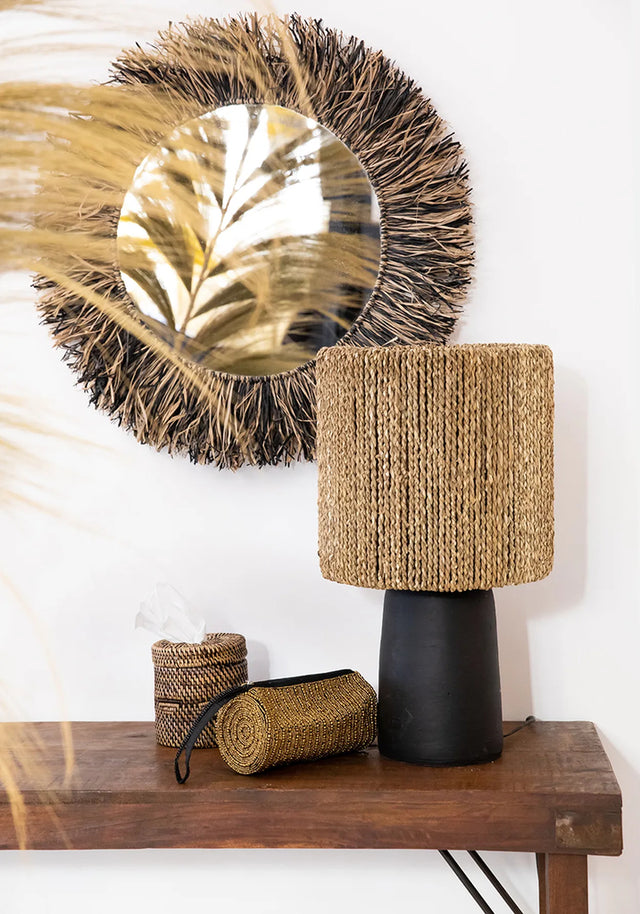 Colonial Handwoven Rattan Tissue Holder in natural brown, placed on a kitchen island for easy access